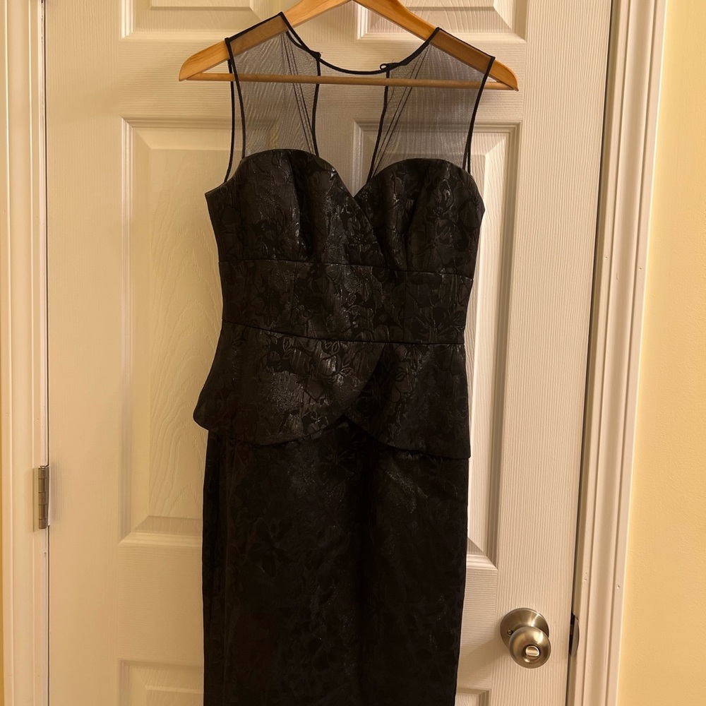 Maggy London Peplum style Metallic Black Dress with sheer top. Size 4.